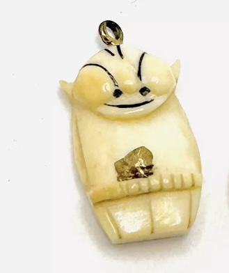 Alaska hand-carved Billiken pendant with gold nugget