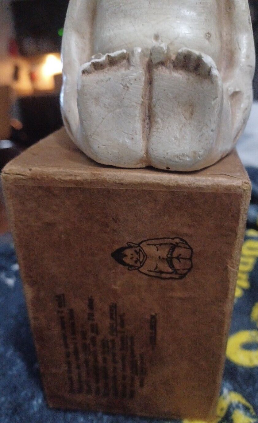 chalkware Billiken figurine atop original box, ca. 1909